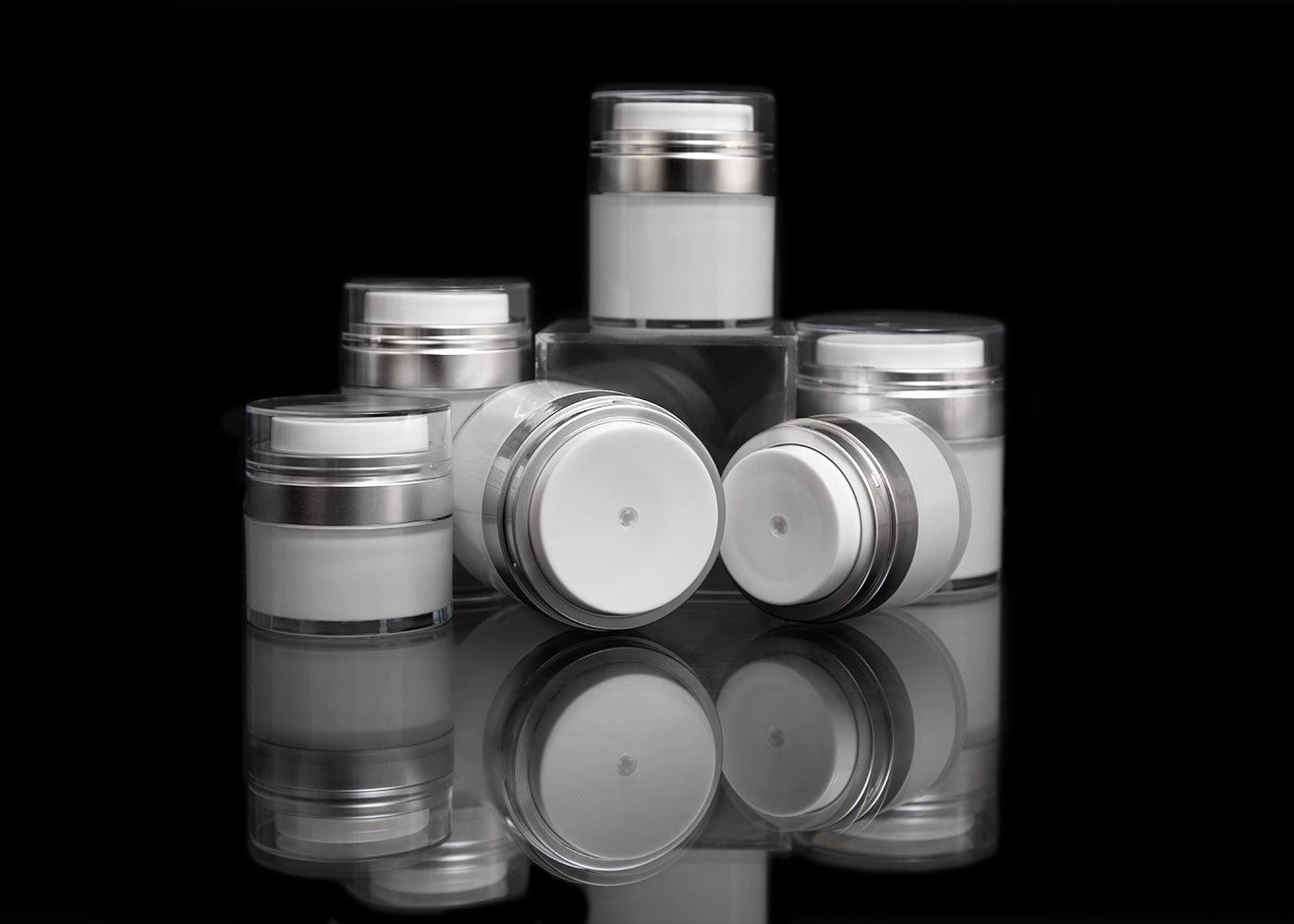 https://www.cosmeticpackagingnow.com/cdn/shop/files/cosmetic-packaging-now-llc-airless-jar-echo-30-ml-airless-jar-with-matte-silver-collar-23316362363078.jpg?v=1703744643